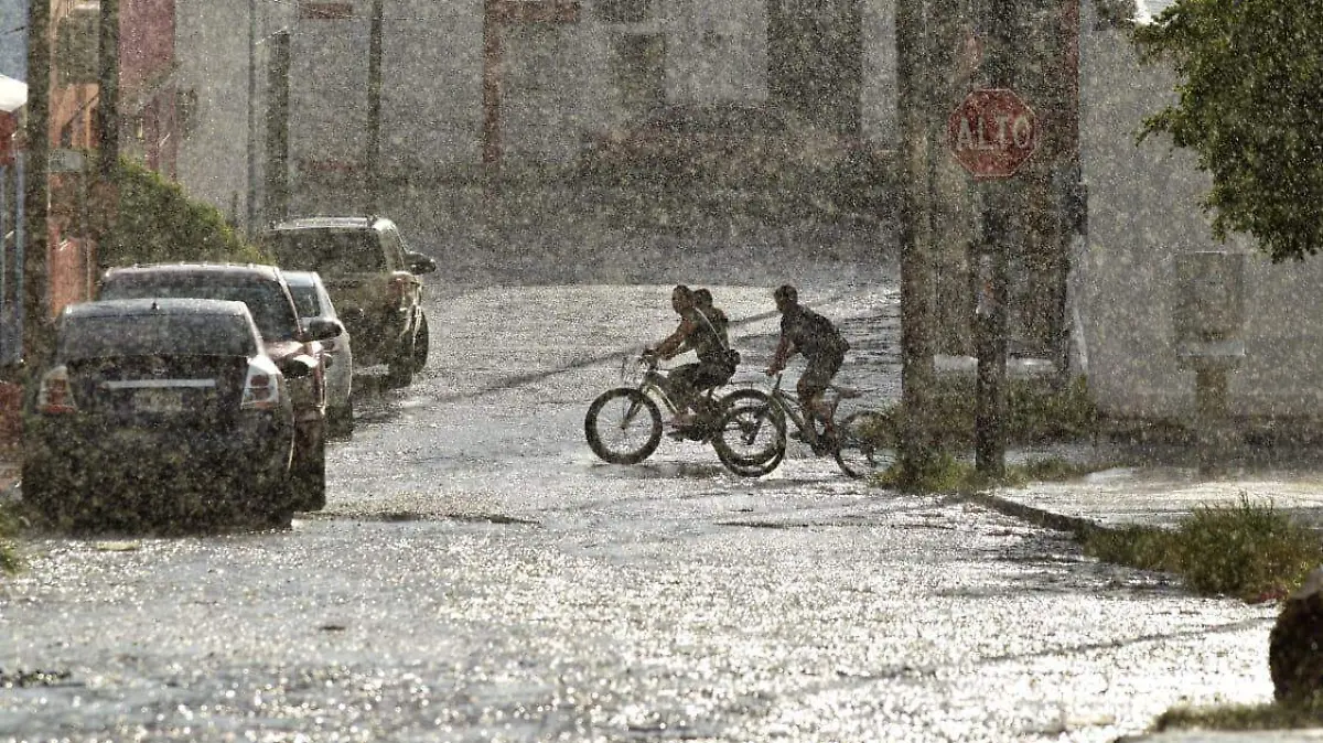 lluvias bicicleta niños